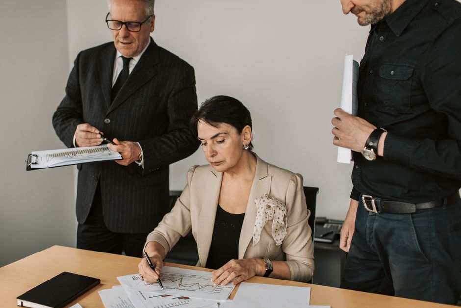 Business professionals reviewing branded corporate stationery